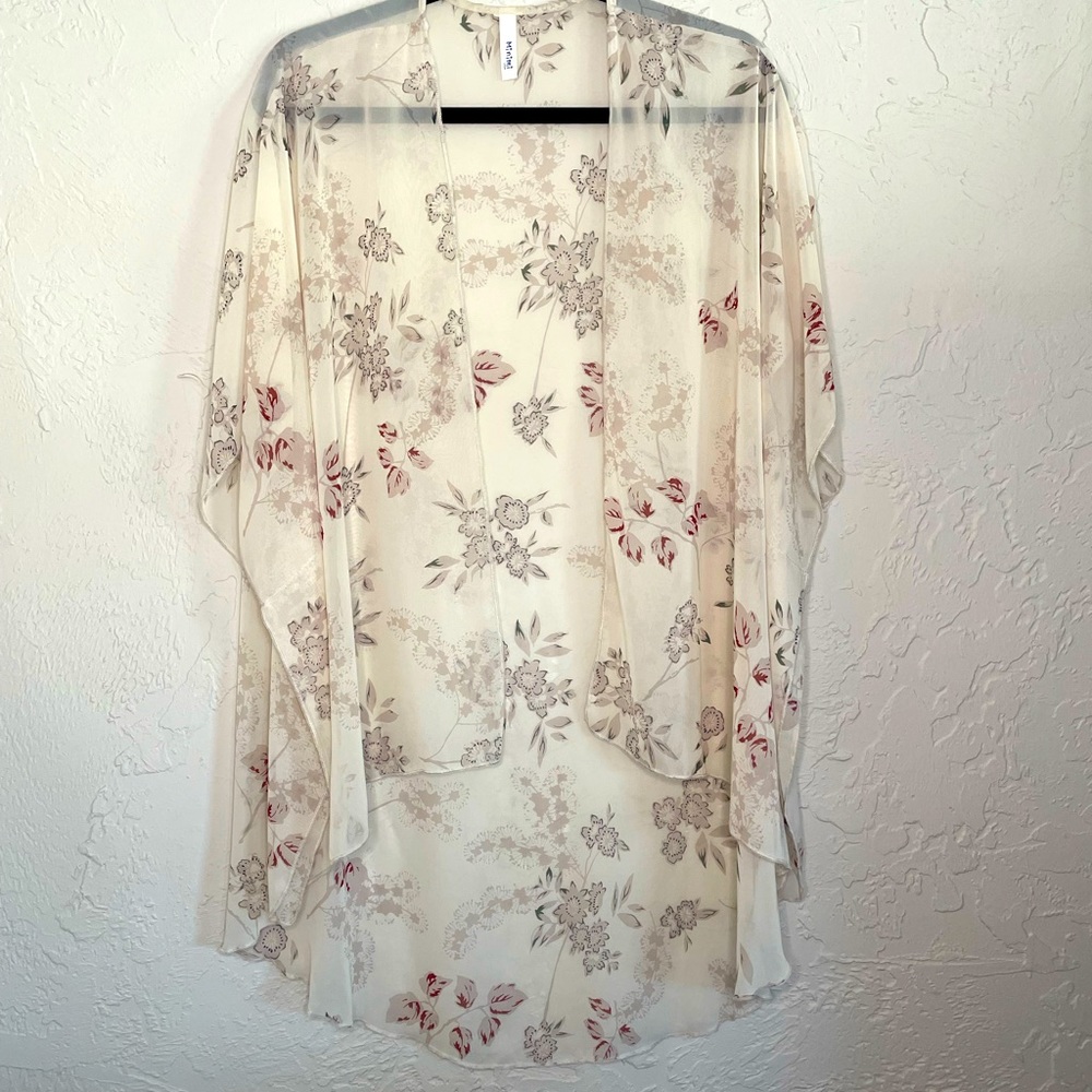 Cream sheer kimono with subtle print. One size.